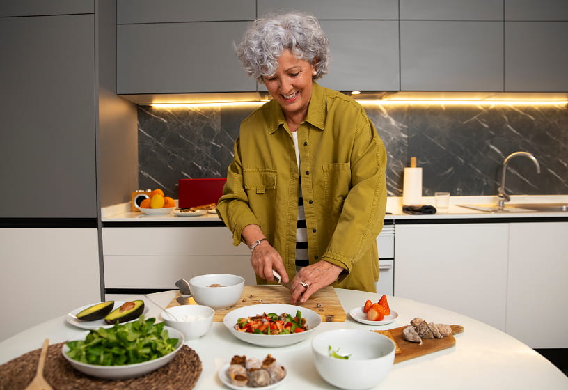 Woman preparing a salad in a modern kitchen