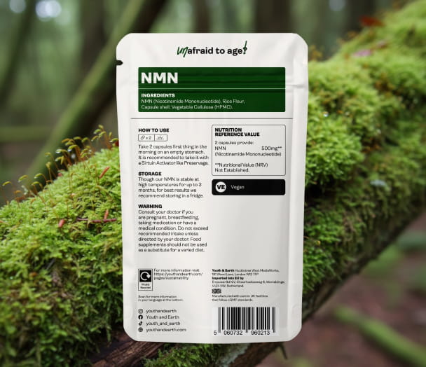 Supplement package labeled 'NMN' with green and white design on a natural background