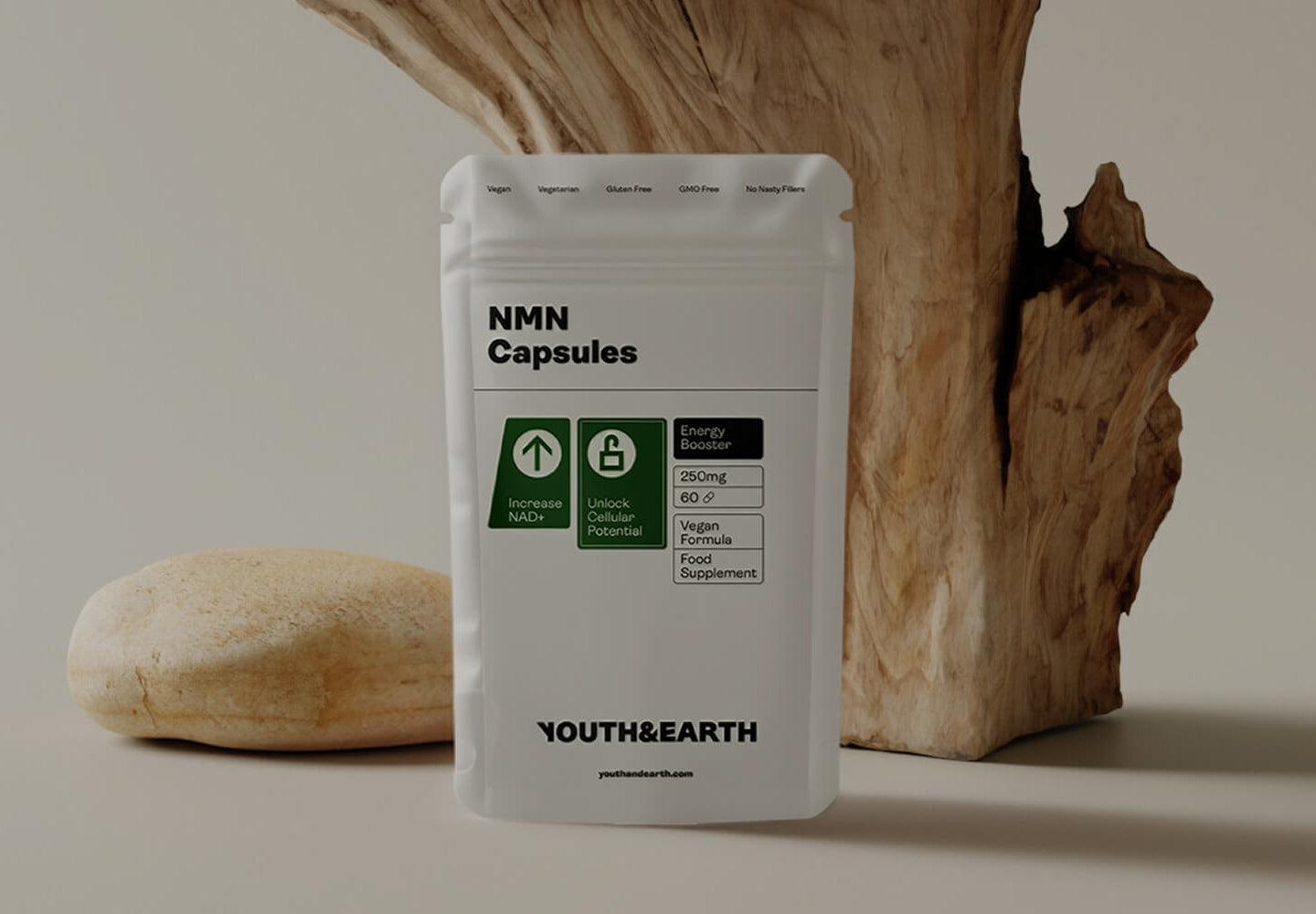 NMN Capsules packaging by Youth & Earth on a neutral background with natural elements.